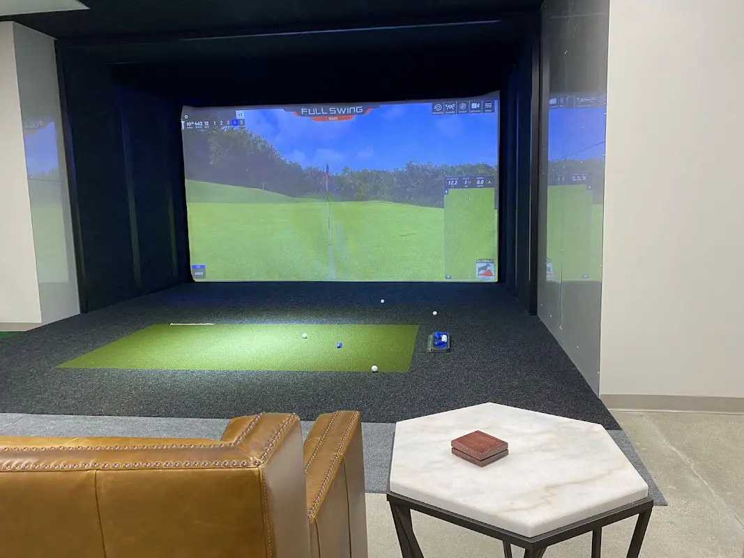 Private Full Swing simulator suite with lounge seating at Swing365 in Rockbrook Village, Omaha