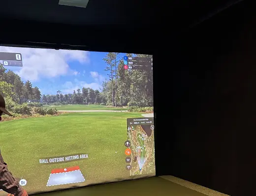 Golf simulator bay at The Iron Hall Indoor Golf – Pocatello in Pocatello