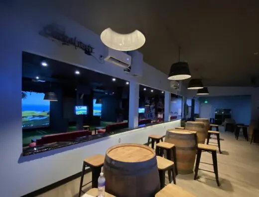 Tables and TVs in the clubhouse at Bayview Golf Center in Baltimore, MD