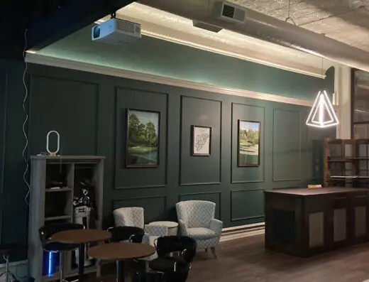 Inside Below Par Golf Lounge - indoor golf in Osage, IA