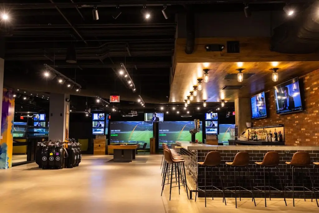 Bar and simulator bays at Five Iron Golf in downtown Pittsburgh