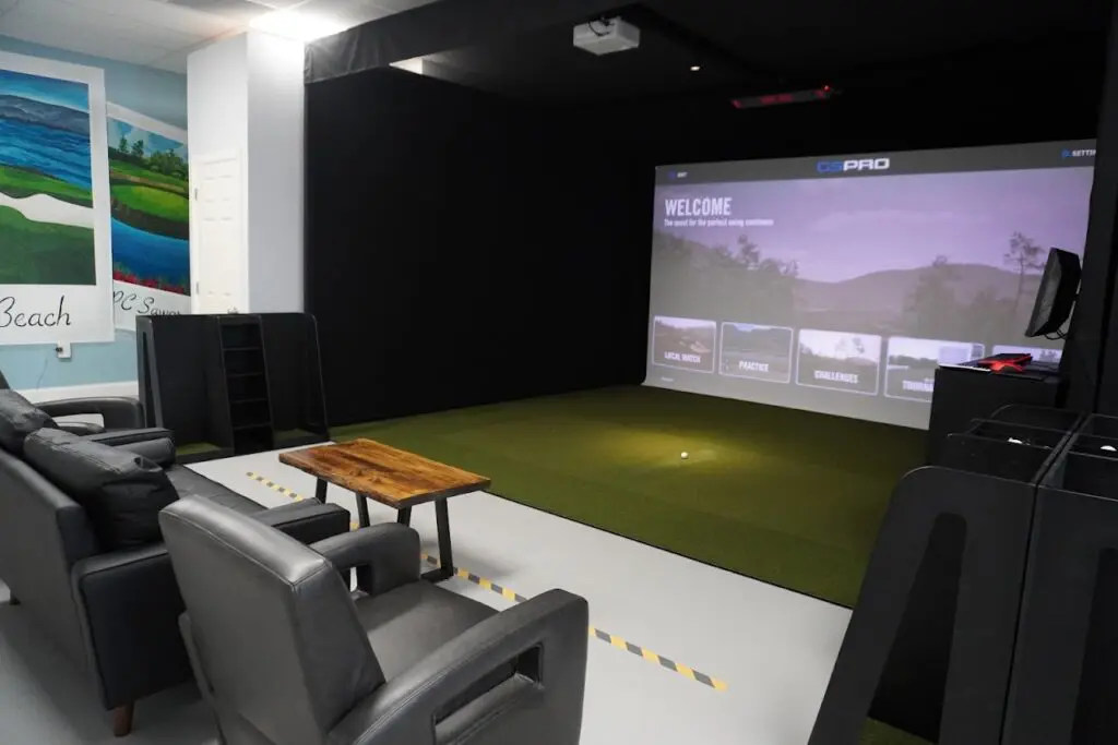 Uneekor simulator bay with a lounge chair inside iGolf Pro in Westerville, Ohio
