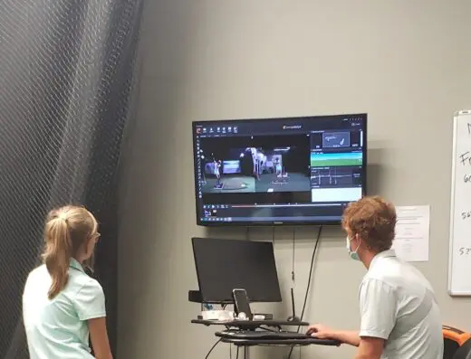 Studio with video analysis monitors at Impact Zone Golf in Naples, FL