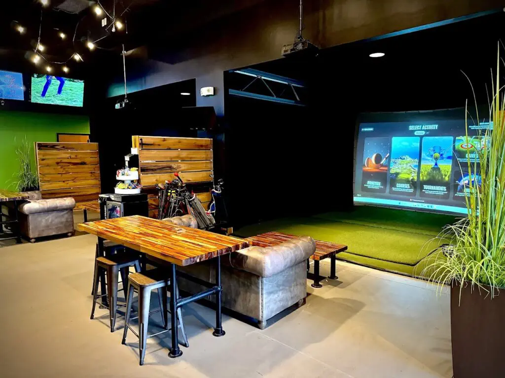 TrackMan simulator bay and lounge seating at Links Social in Spring Hill, Tennessee