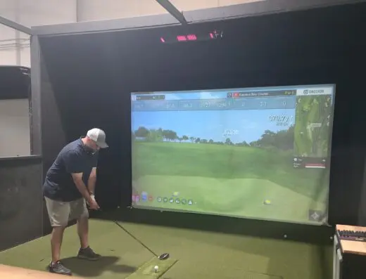 Indoor practice area with mats at Midland Golf HQ in Midland, MI