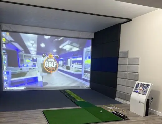 Row of sim bays at Royal Golf Zone in Dallas, TX