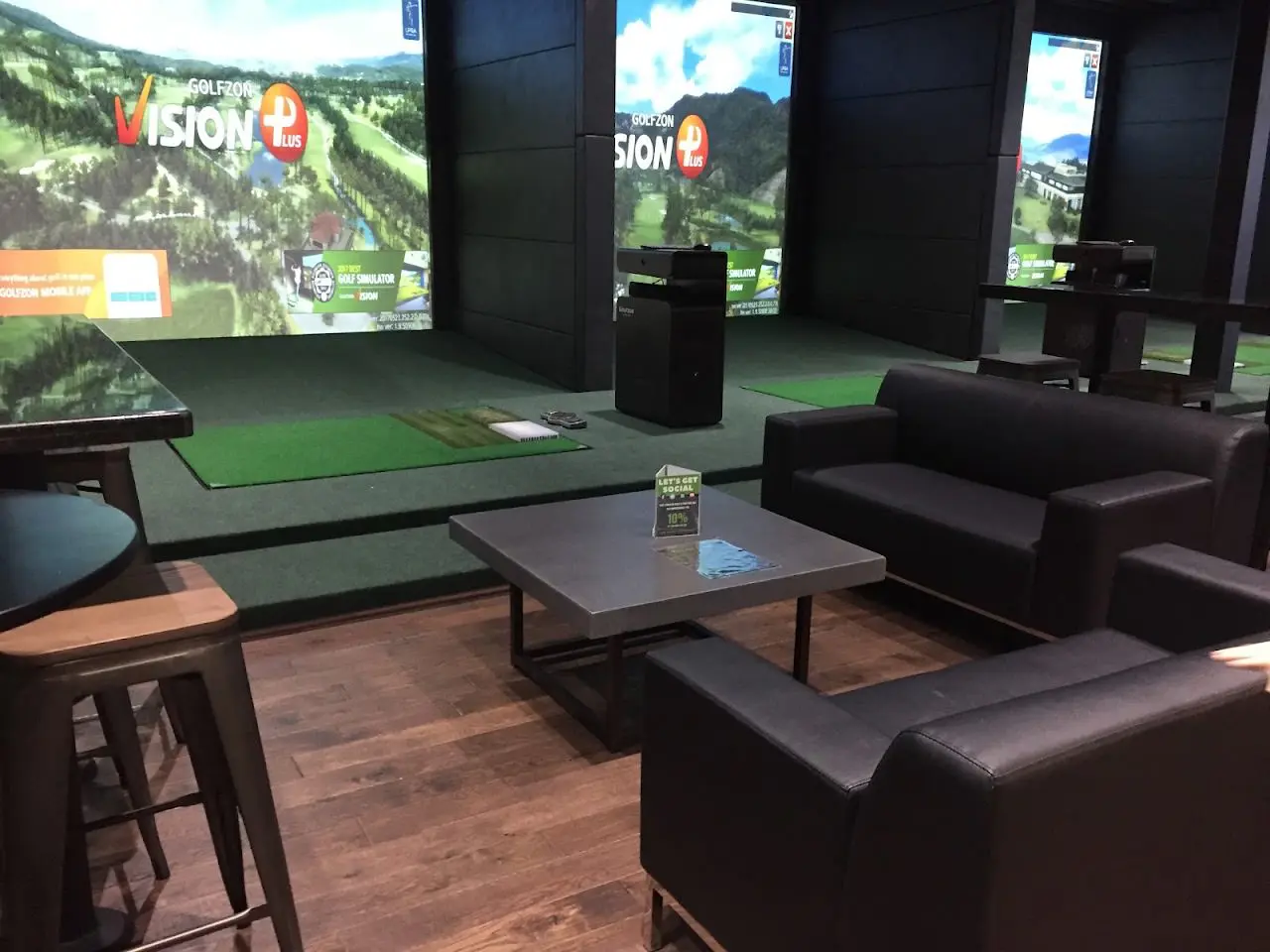 Simulator bays and bar at Swing Zone in Tomball, north of Houston