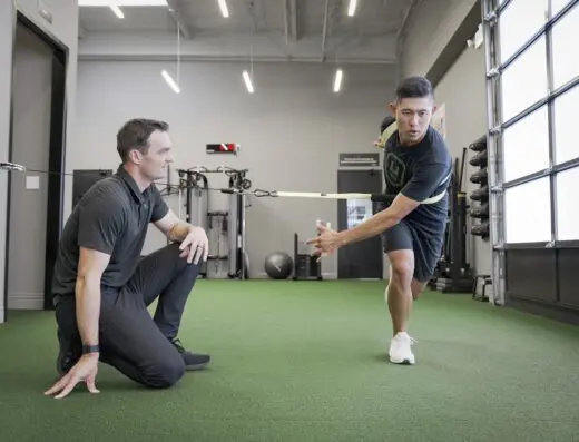 Bay with two people mid-session at Urban Golf Performance Costa Mesa in Costa Mesa, CA