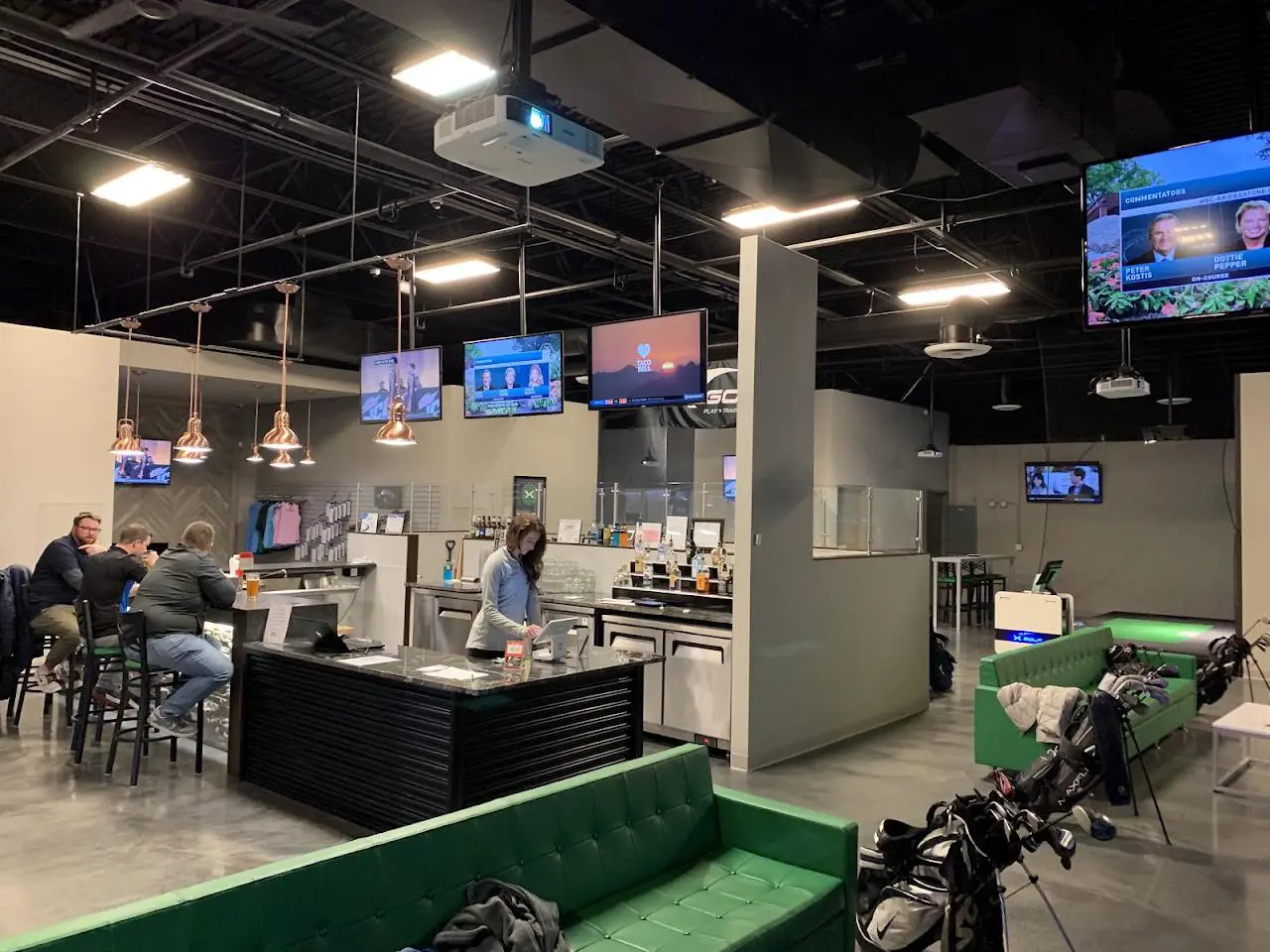 X-Golf Grand Rapids indoor golf simulator bays on 28th Street SE