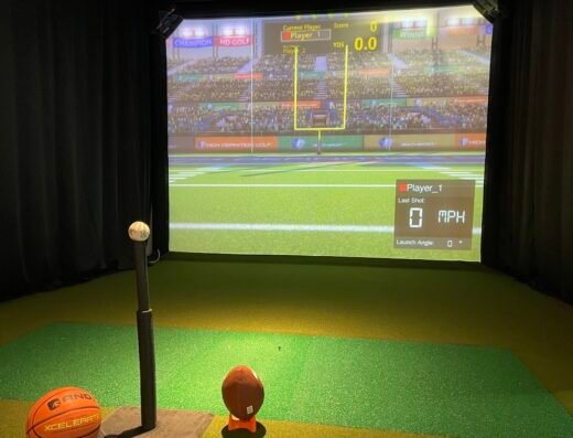 Putting mat game station; pro shop with clubs elsewhere in set at Above Par Golf & Entertainment in Leonardtown, MD