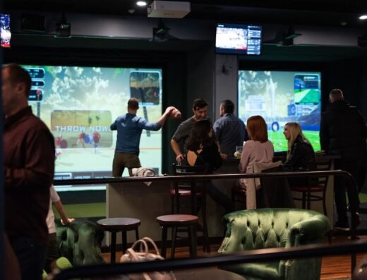 Groups playing in the simulator bays at Back9 Parlor in Lynnwood, WA