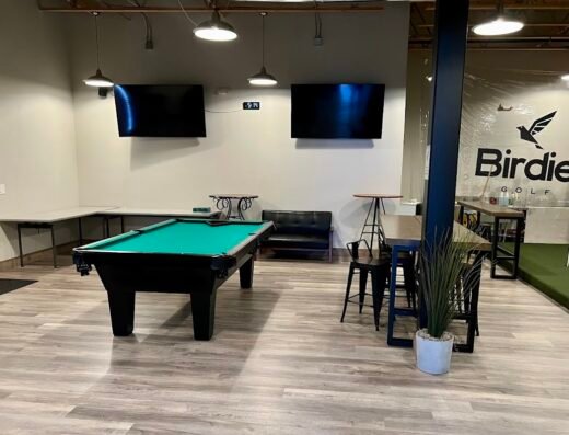 Lounge with pool table at Birdie Golf in Ogden, UT