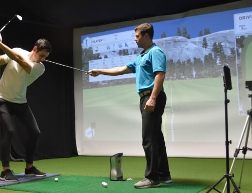 Instructor and student at the screen at Elevation Golf Academy Indianapolis in Carmel, IN