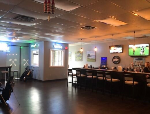 Lounge and simulator bays at The Links Indoor Golf in Findlay, OH