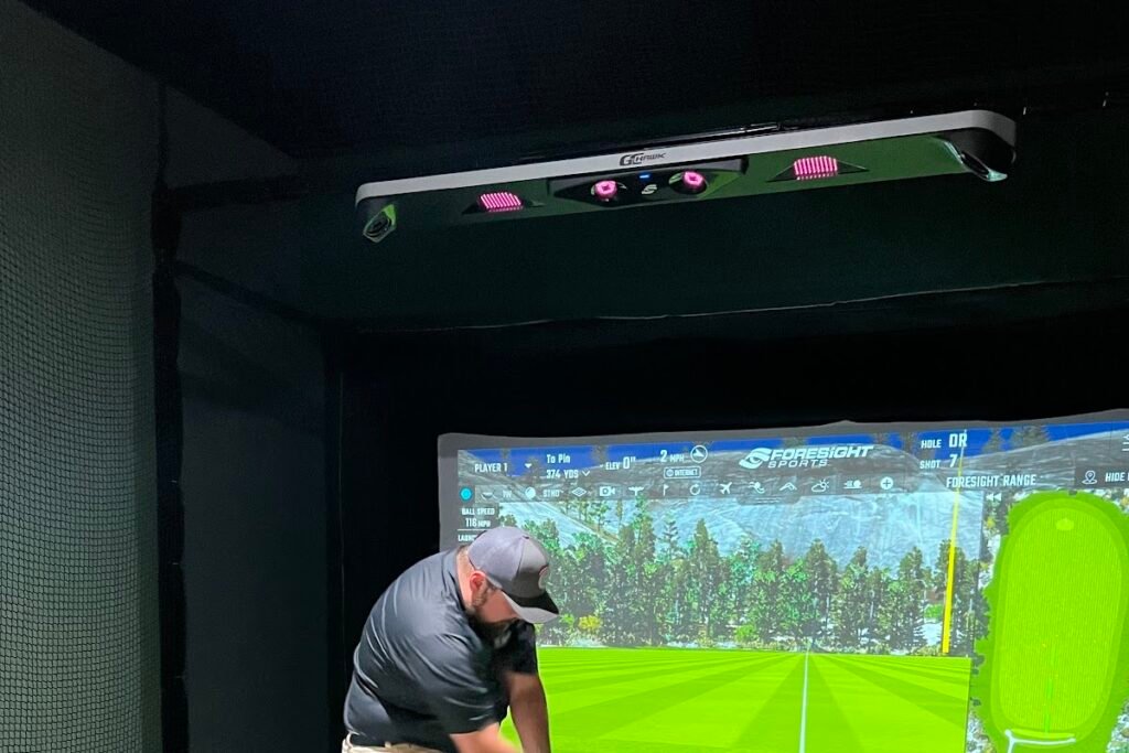 Three simulator bays and lounge inside Virtual Fairways in Pickerington, Ohio
